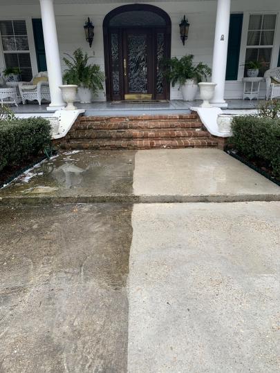 What are the benefits of professional concrete cleaning for driveways and walkways